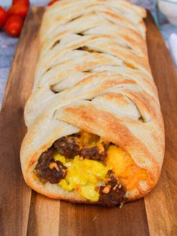 Ready for a breakfast recipe that you are going to LOVE! This one was so simple and wrapped up all my favorite breakfast ingredients. I used canned pizza dough to make the braid and stuffed it with eggs, sausage, and cheese!