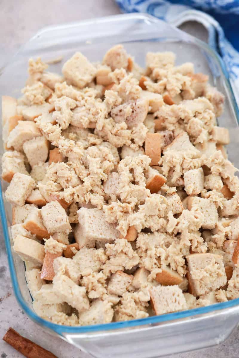 adding bread to the casserole dish