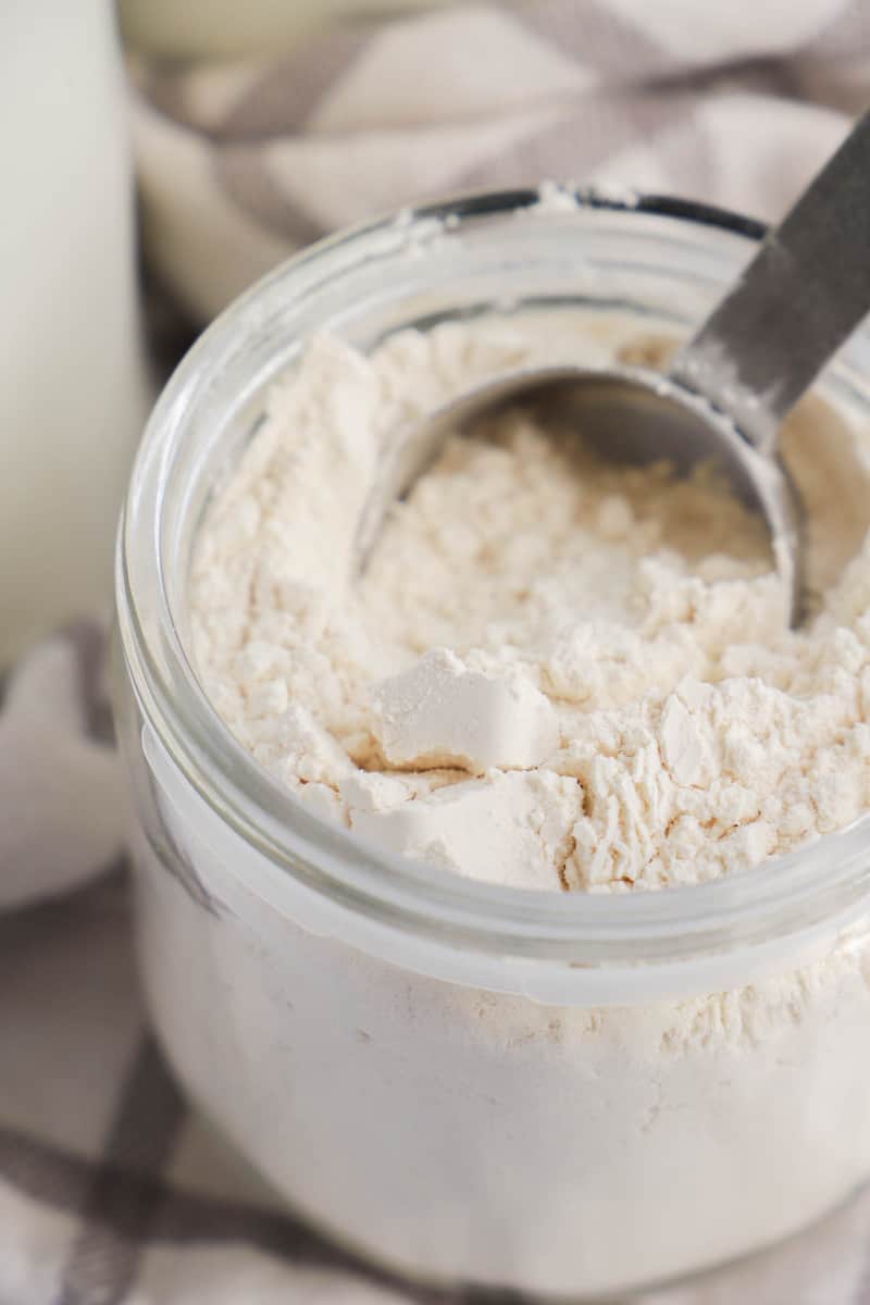 scooping pancake mix out of jar