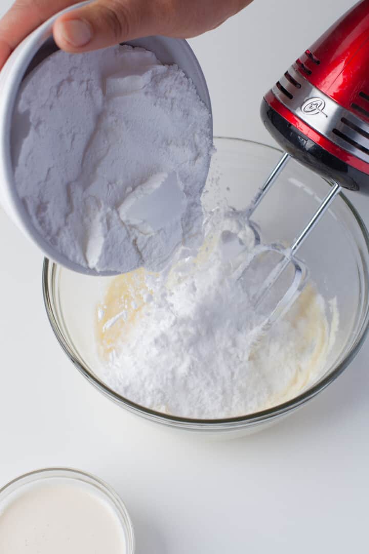 mixing together the wet and dry ingredients for the cupcakes