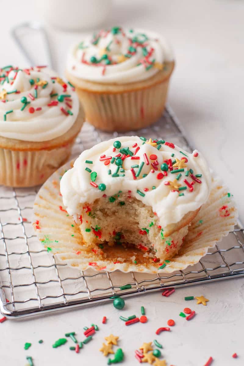 Christmas Funfetti Cupcakes with bite taken out of it