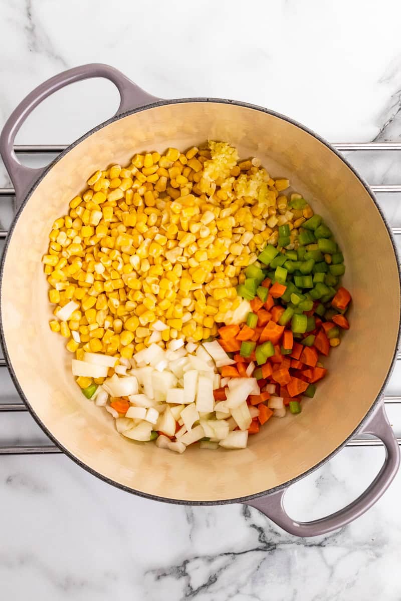 melting the butter then cooking the veggies