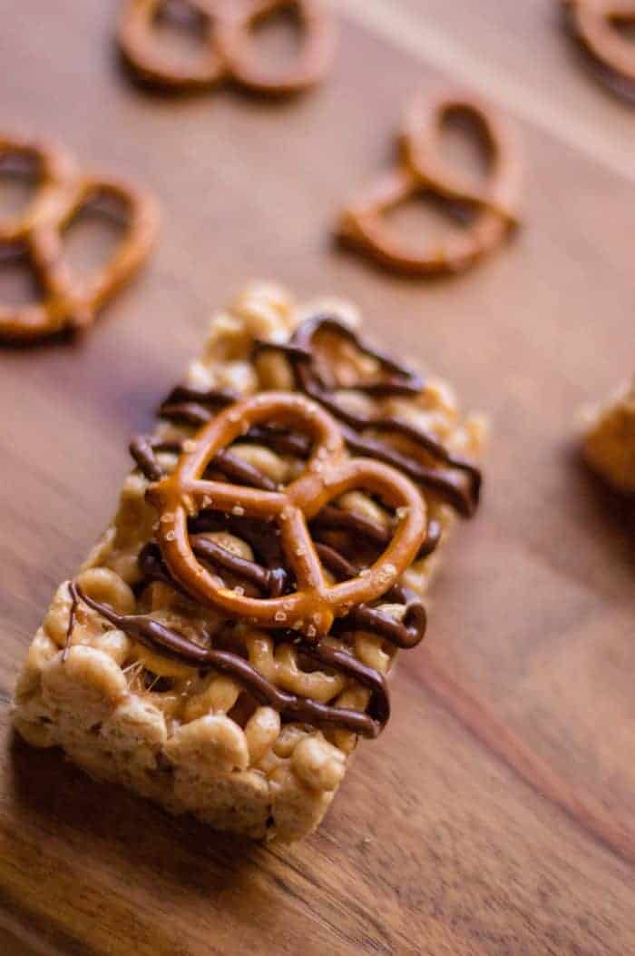 Cheerio Peanut Butter Pretzel Squares on wooden board