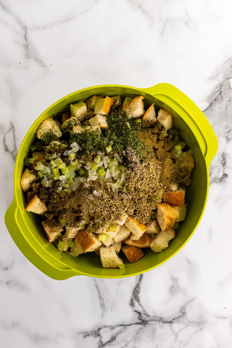 adding seasoning to the mixing bowl