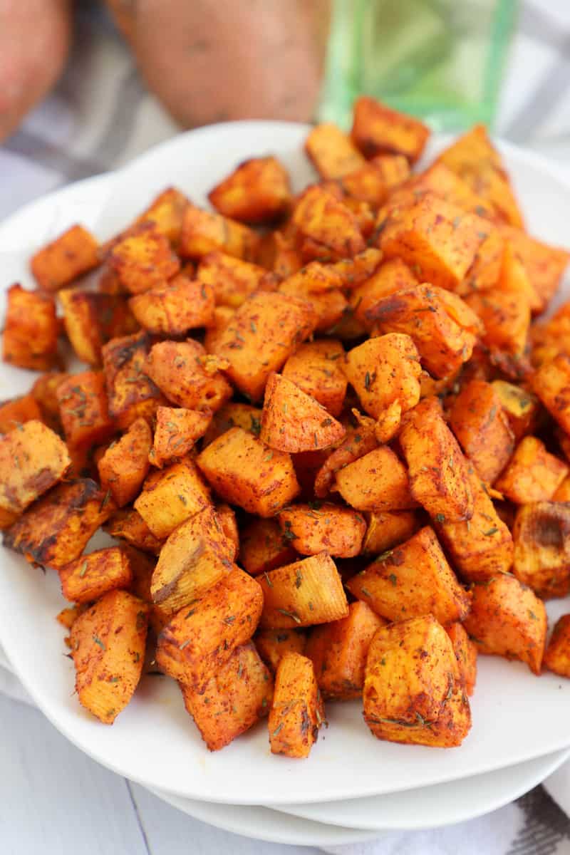 Air Fryer Sweet Potatoes on stacked white plates