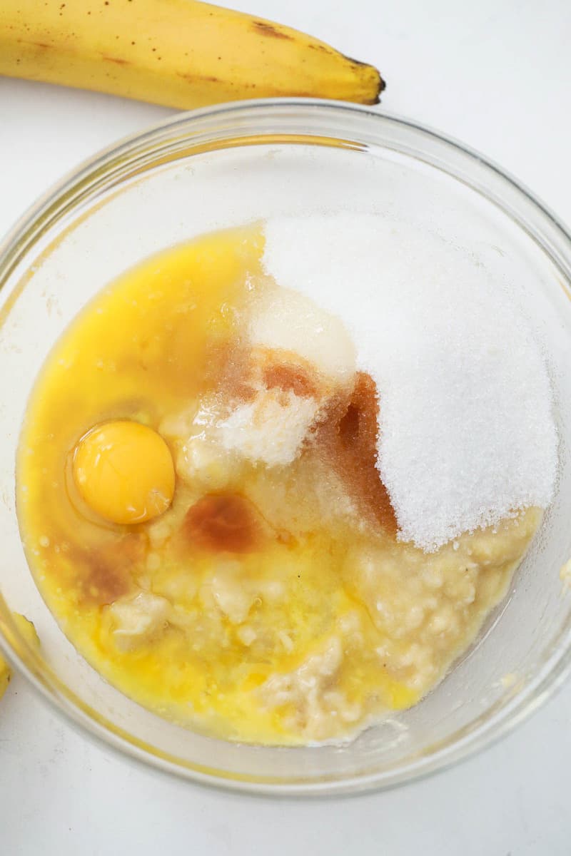 mixing up bananas egg sugar together for the batter