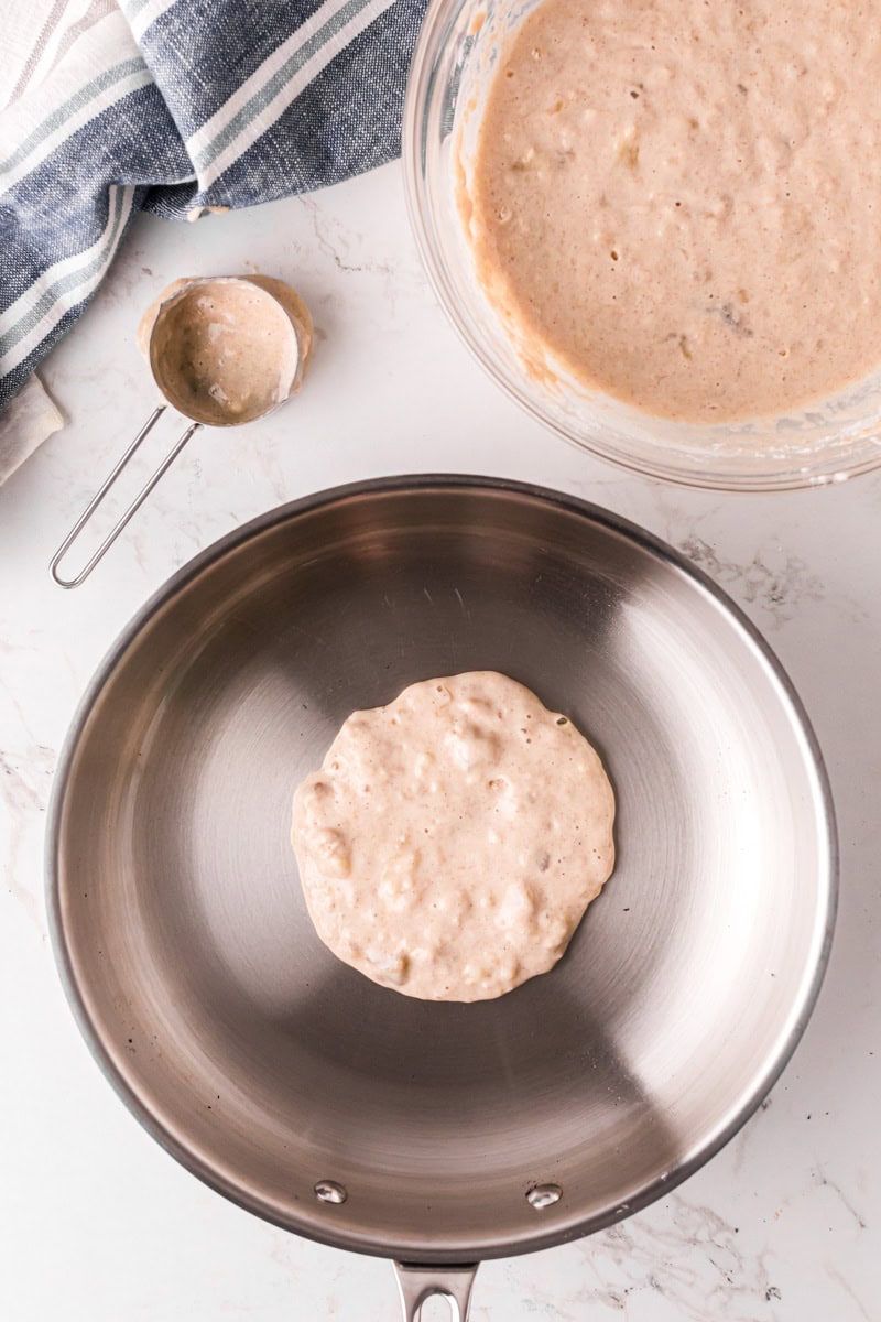 making a pancake on a skillet.