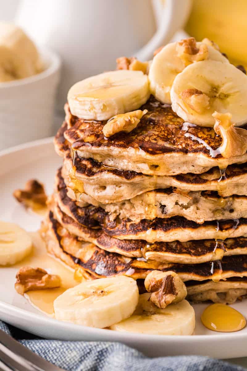 closeup of the Banana Pancakes stacked on top of each other.