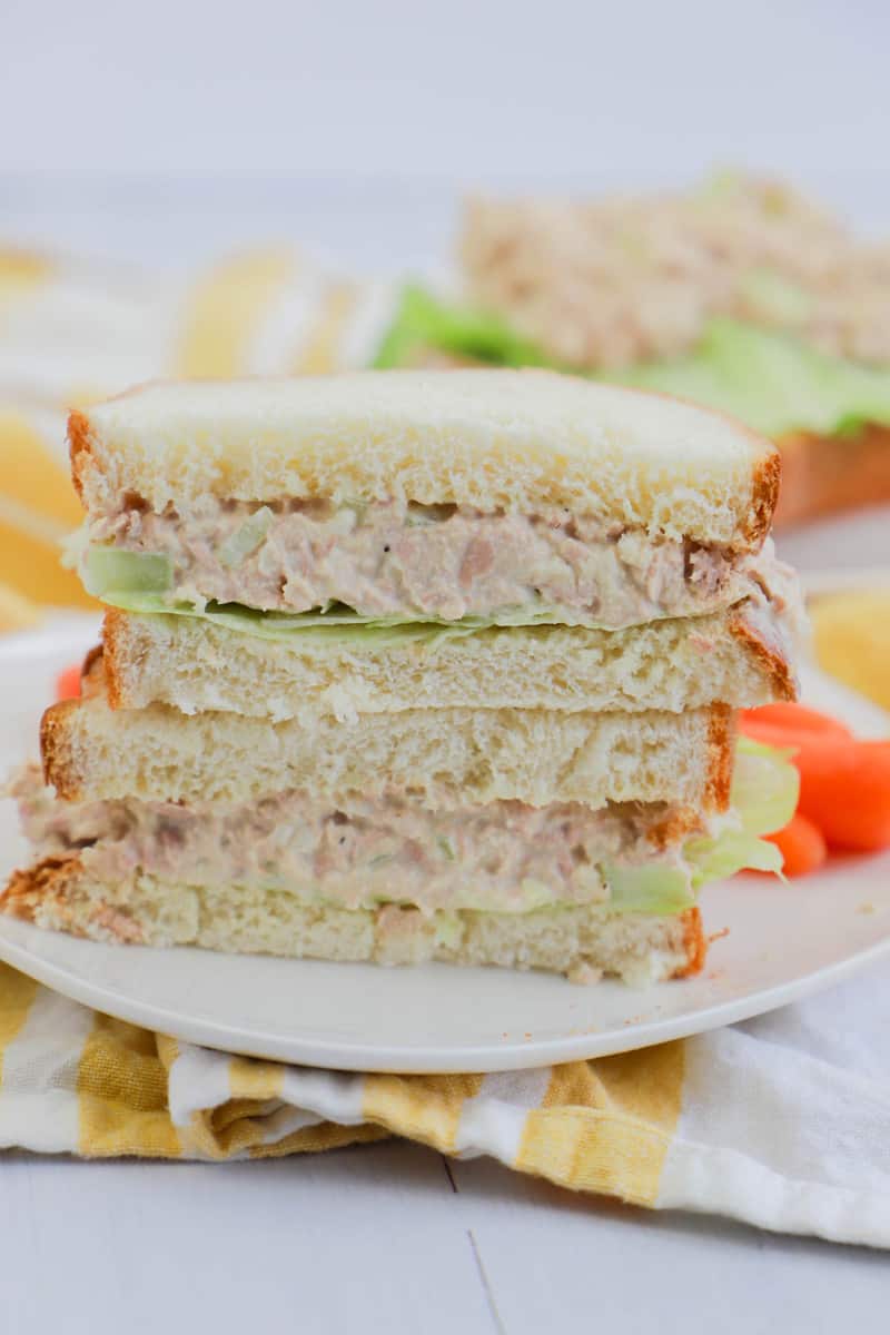 tuna salad sandwich sliced and stacked