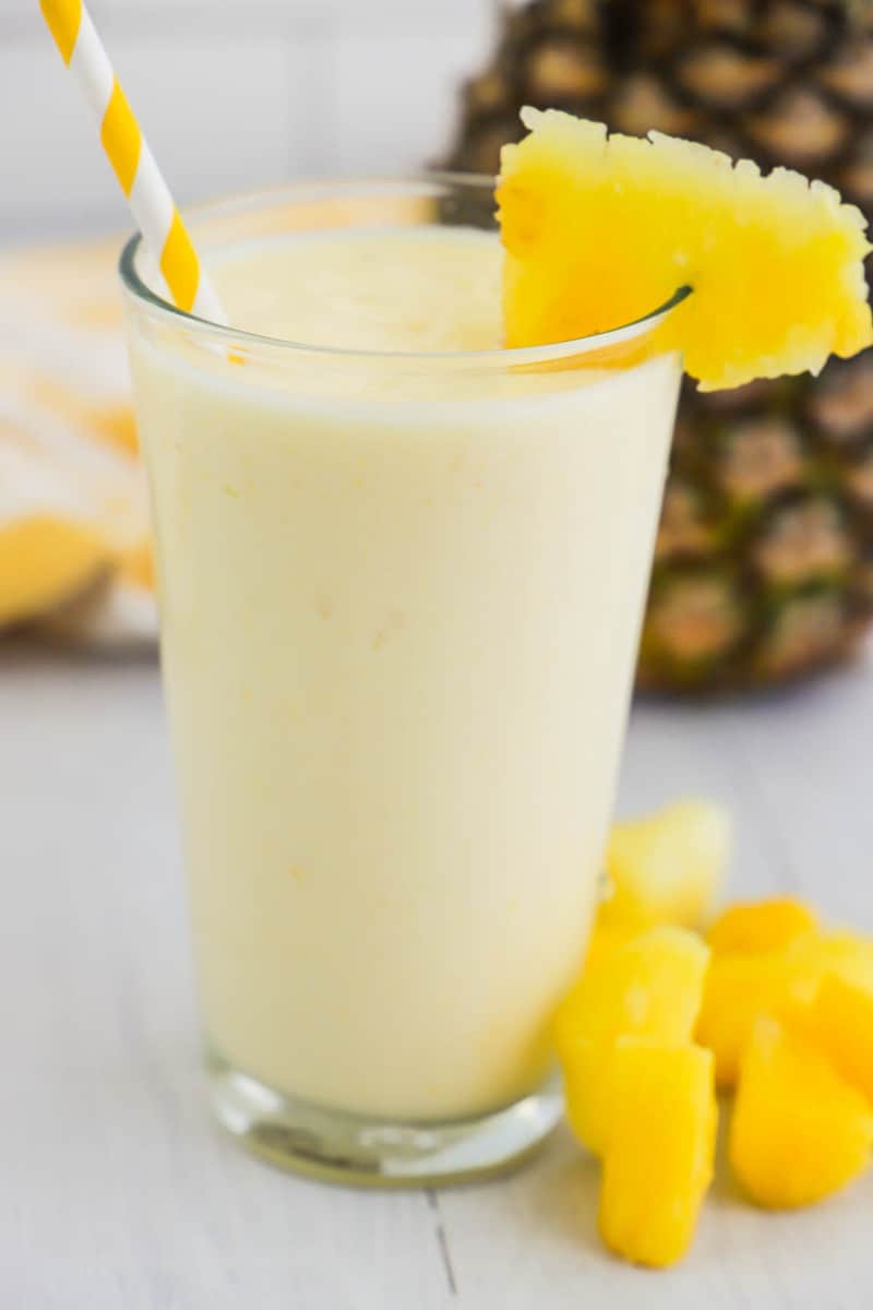 Mango Pineapple Smoothie in glass with pineapple slice