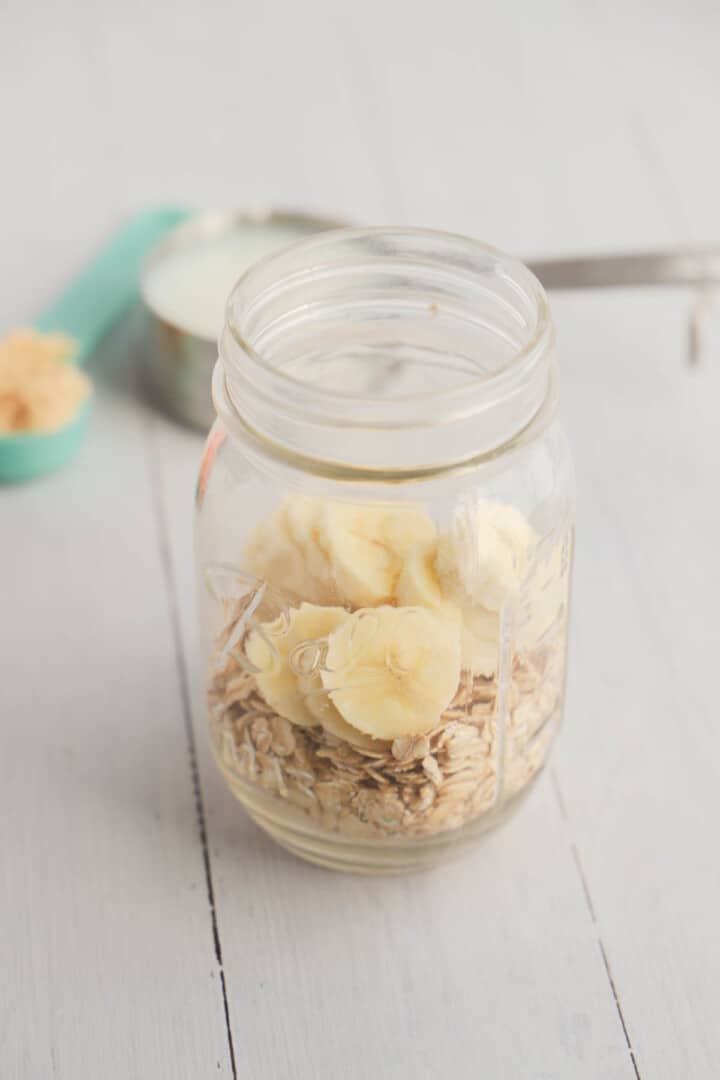 adding overnight oat ingredients to mason jar