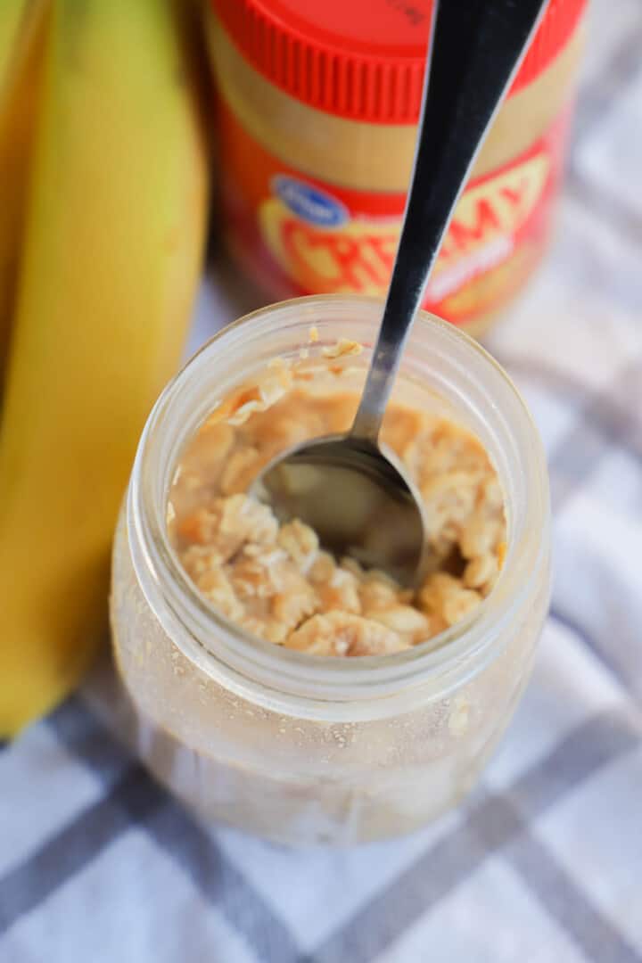 eating the oats out of the mason jar with a spoon