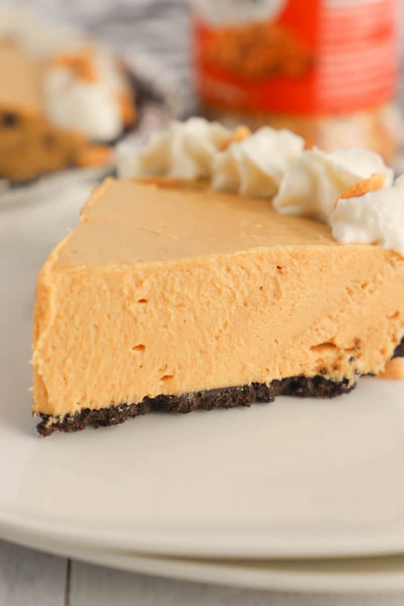 Peanut Butter Pie with Oreo crust on white plate