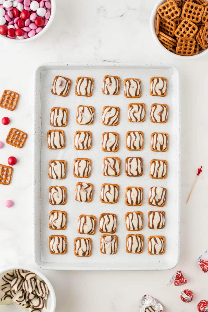 melted hug candies on top of the pretzel out of the oven.