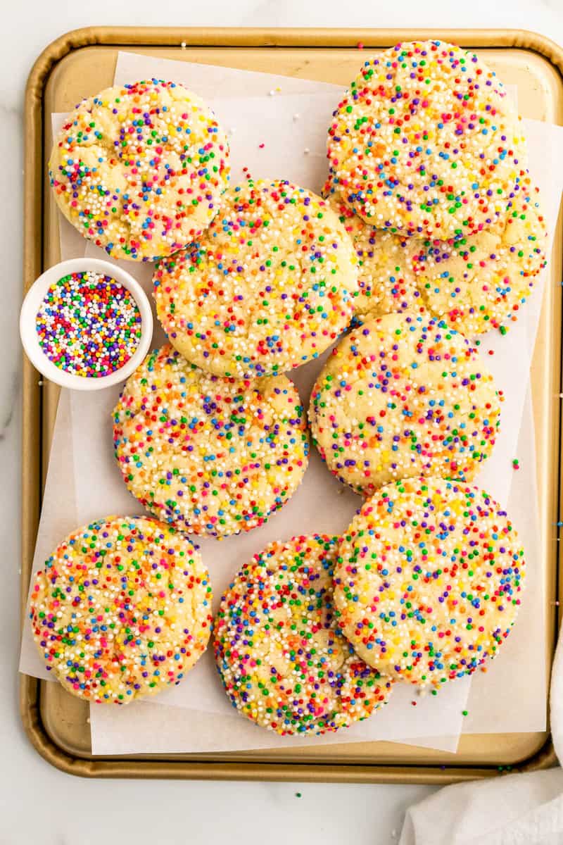baked sprinkle cookies on baking sheet. 
