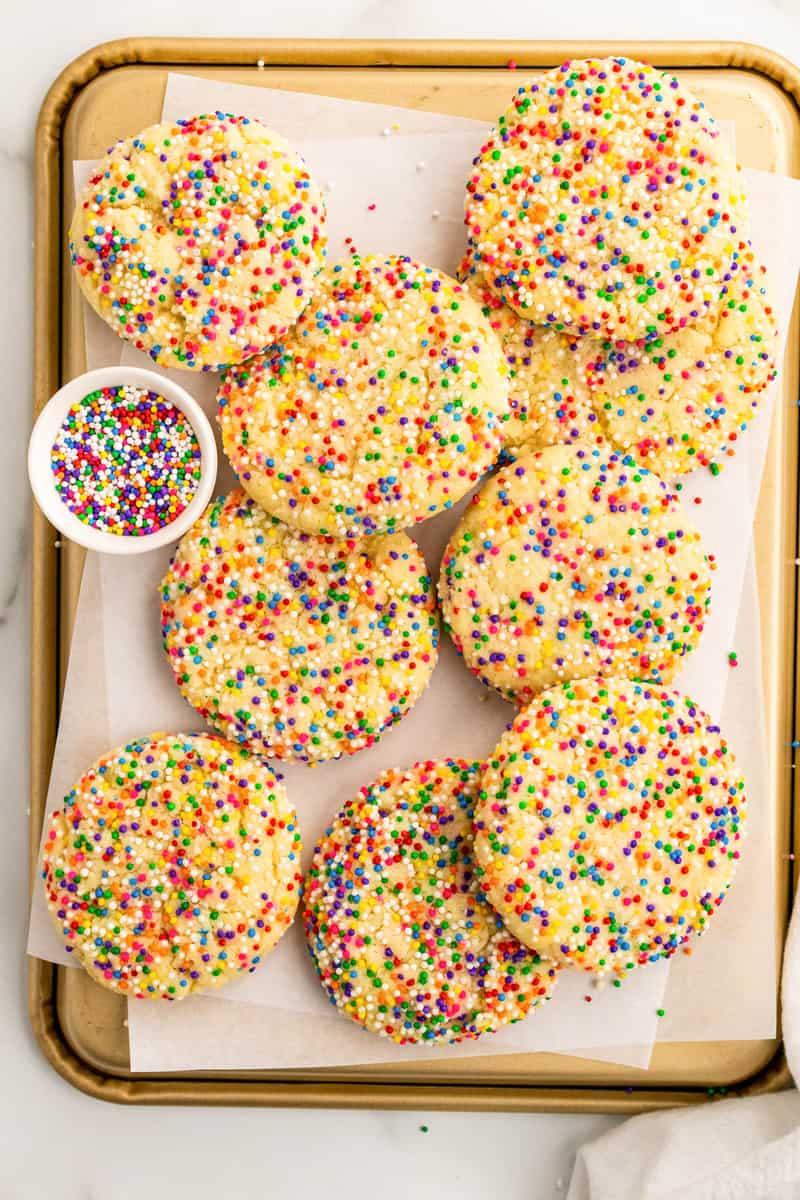 baked sprinkle cookies on baking sheet. 