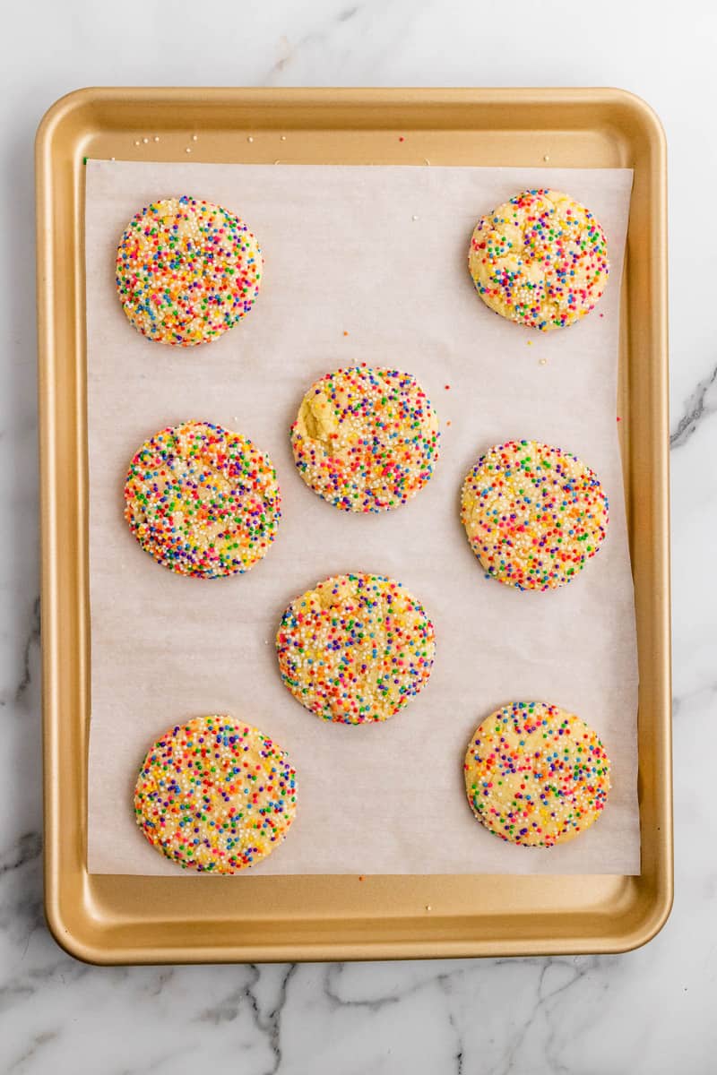 baked sprinkle cookies on baking sheet