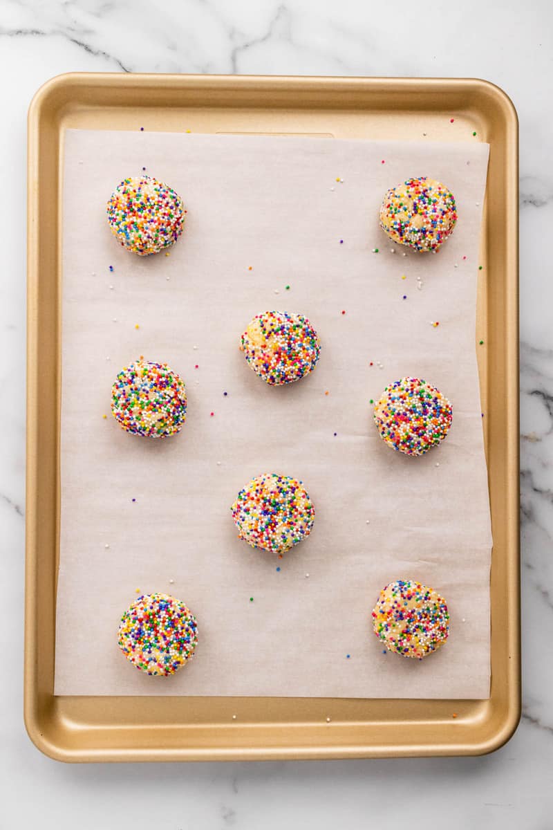 sprinkle cookie dough on baking sheet