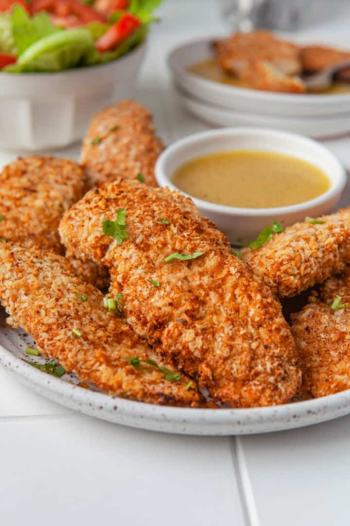 Air Fryer Breaded Chicken Tenders on a white plate