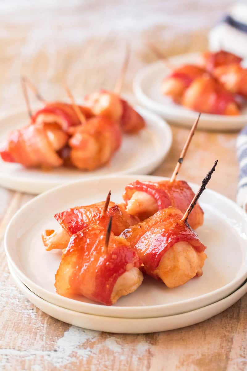 Bacon Wrapped Chicken Bites on white serving plate