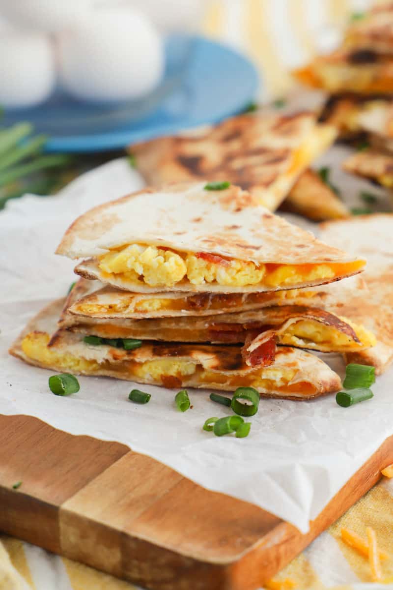 Breakfast Quesadillas sliced on wooden serving board