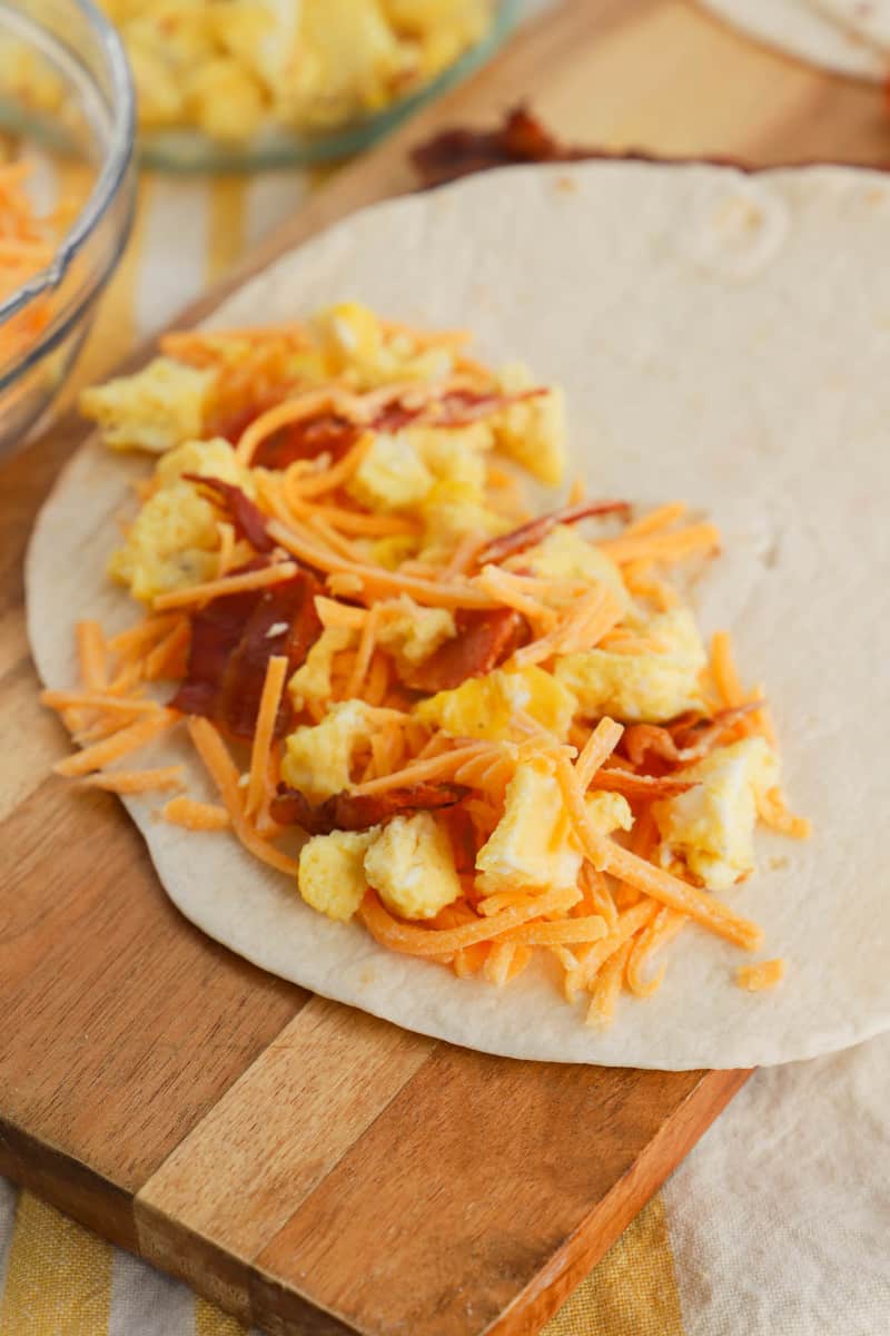 making the breakfast quesadillas before grilling them