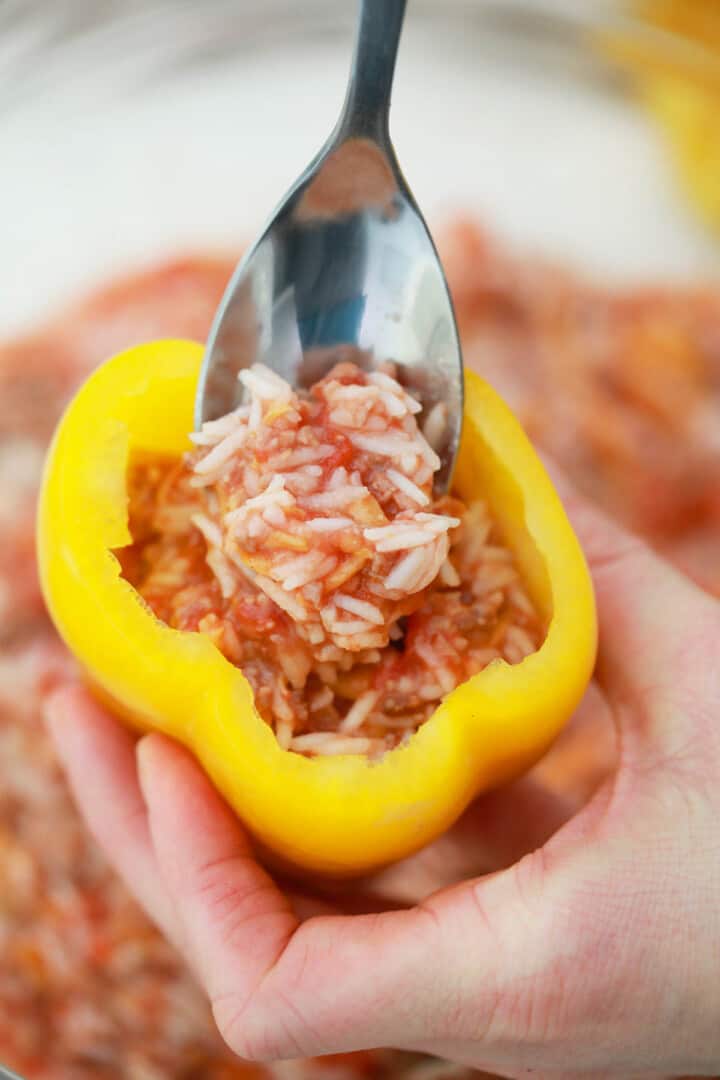 stuffing the peppers with the filling