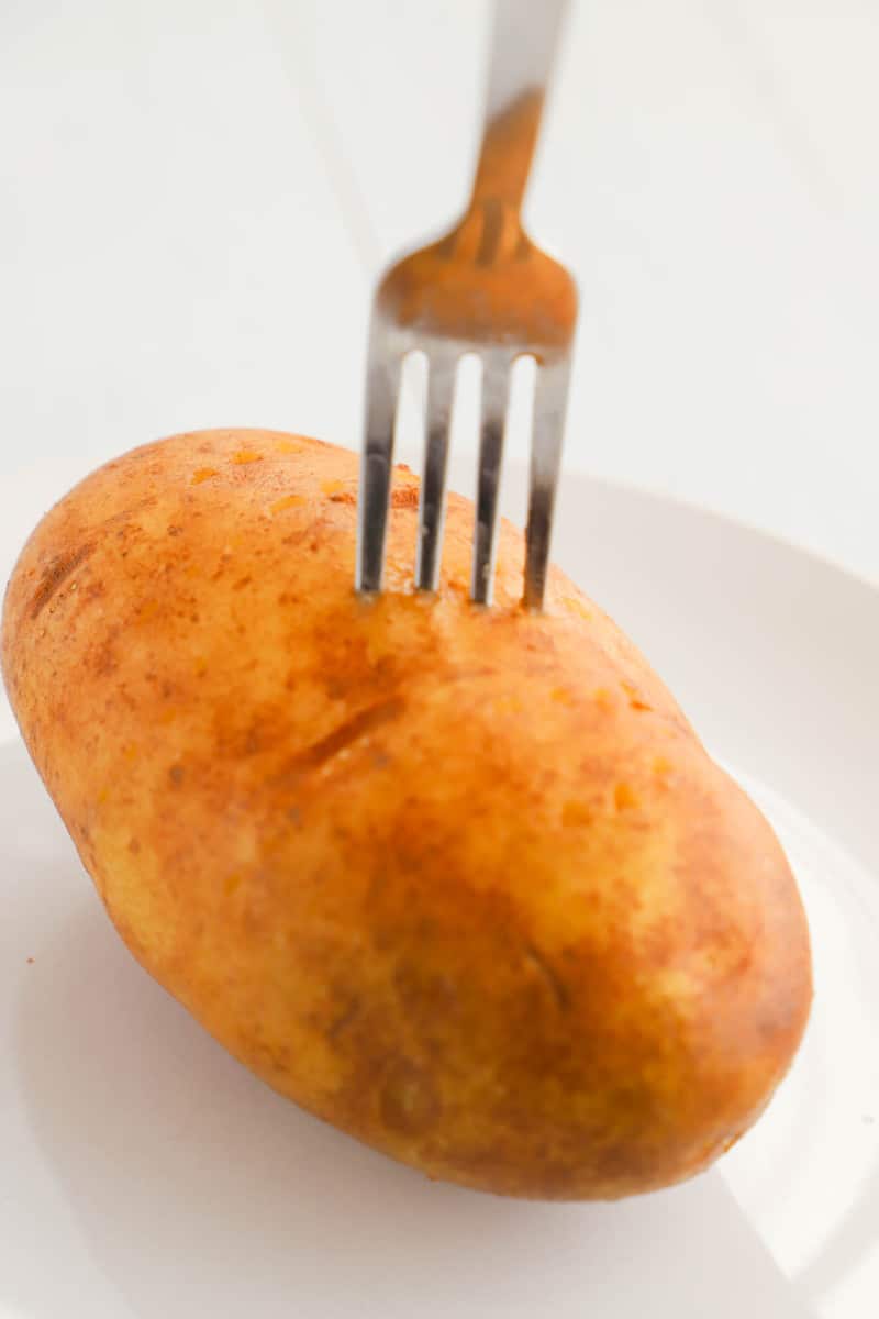 poking holes in potato with fork before microwaving
