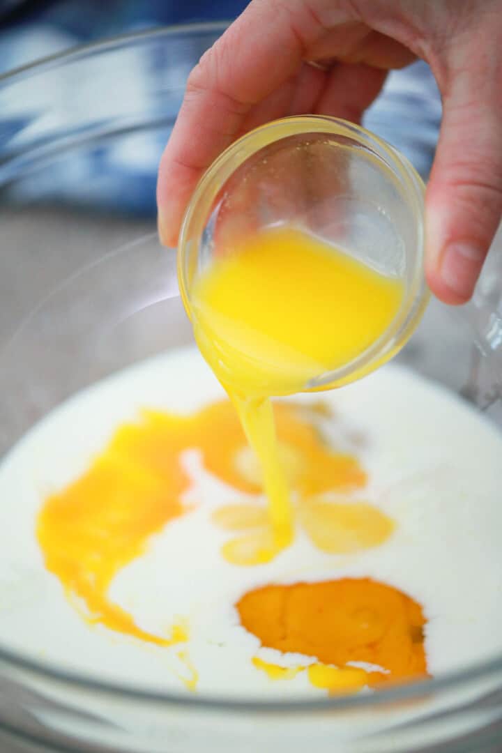 adding the milk and eggs to the pancake mix