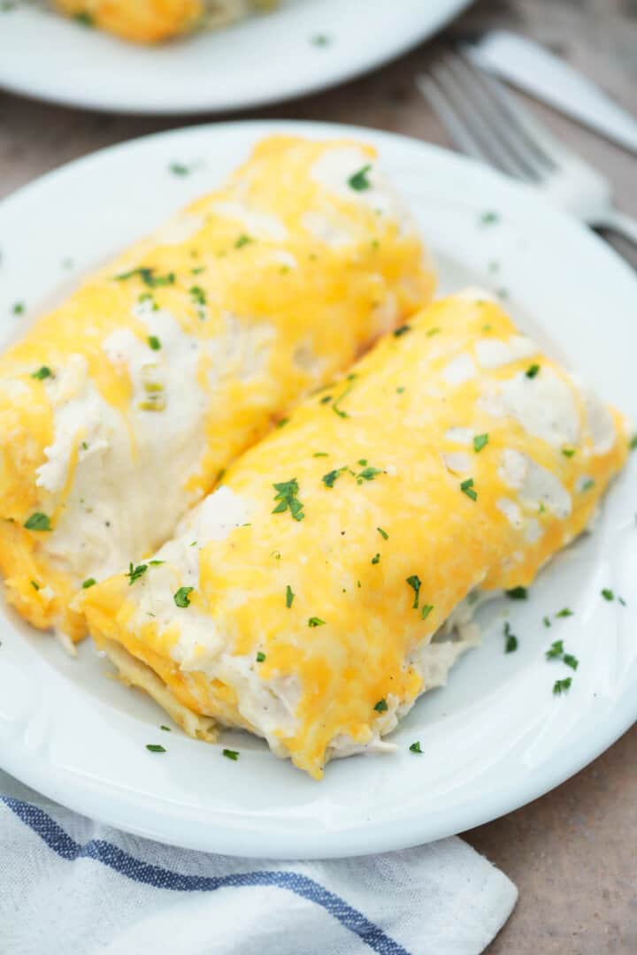 Sour Cream Chicken Enchiladas on white plate