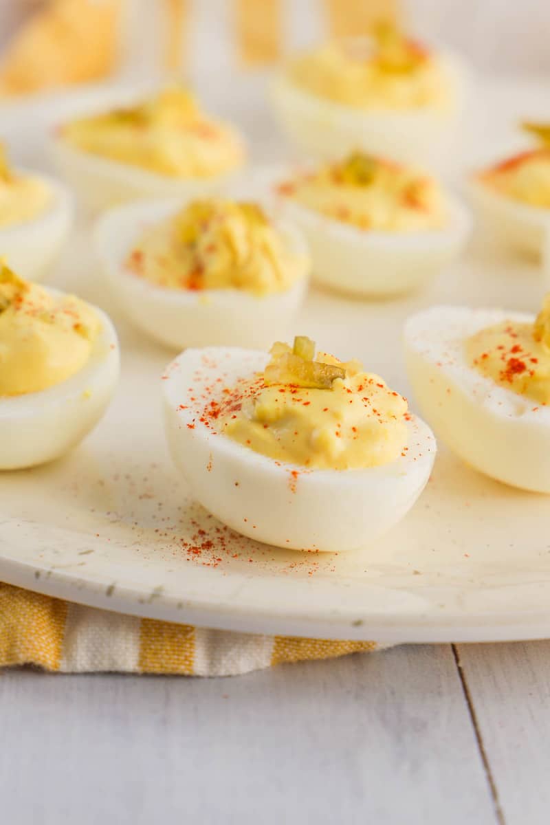 deviled eggs topped with paprika and relish