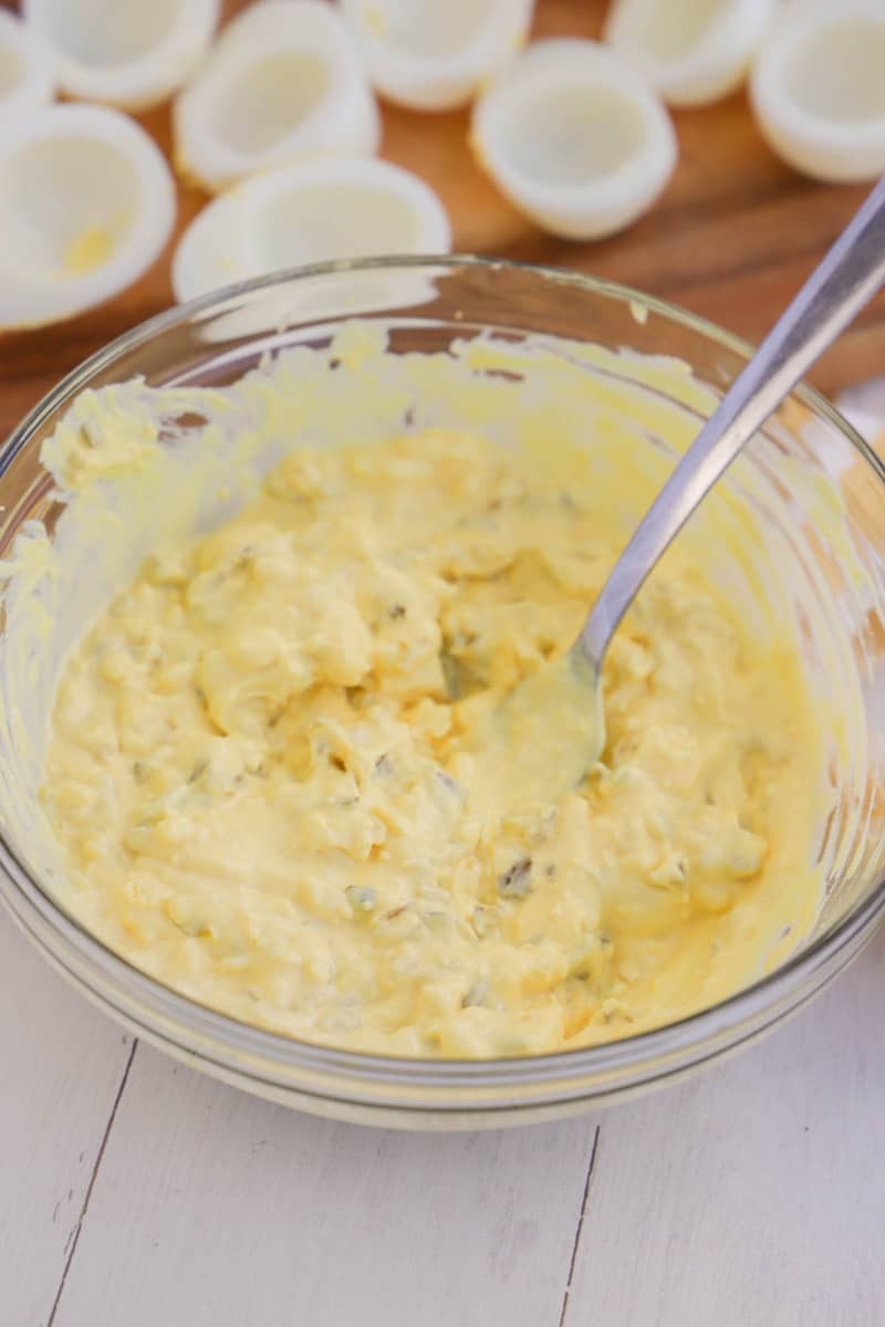 mixing together the egg yolks and other ingredients