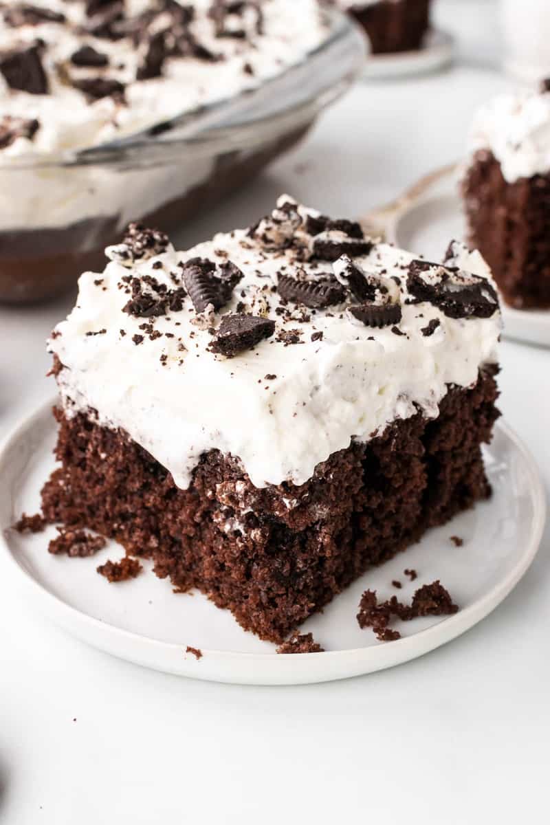 Oreo Poke Cake on white serving plate