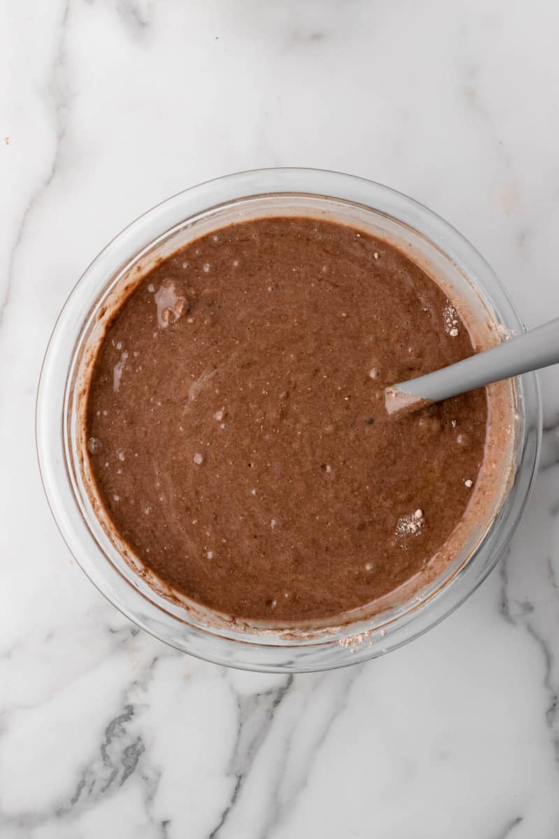 mixing the cake batter for the Oreo Poke Cake