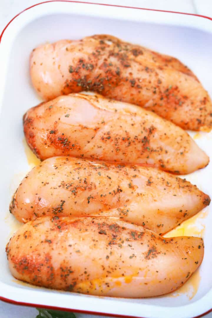 chicken breasts in baking dish.