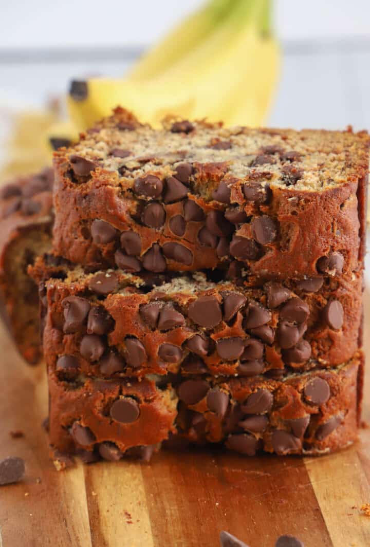 three slices chocolate chip banana bread stacked on top of each other