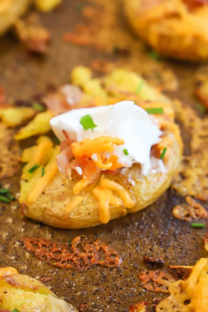 closeup of smashed potato topped with all the toppings