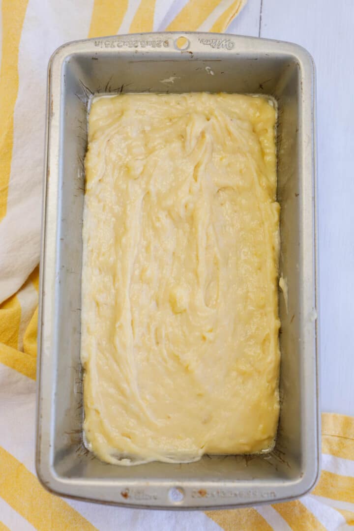 pouring batter into bread pan