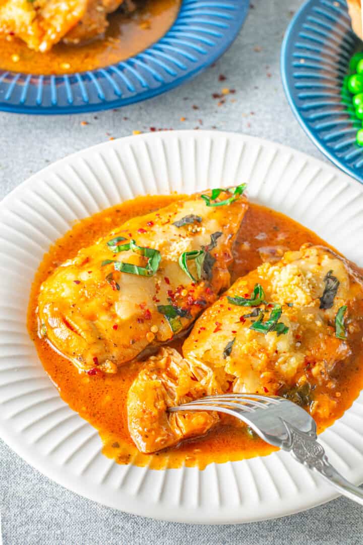 using fork to separate parmesan chicken