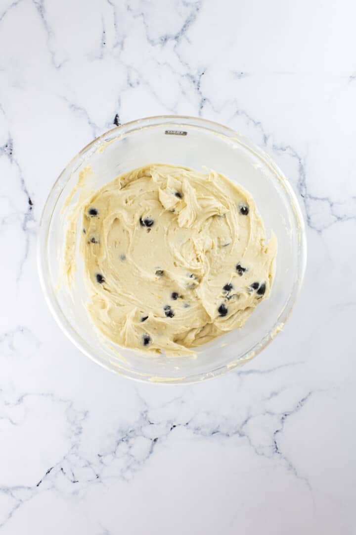 folding in the blueberries to the batter