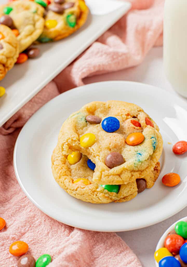 close up M&M cookie on white plate