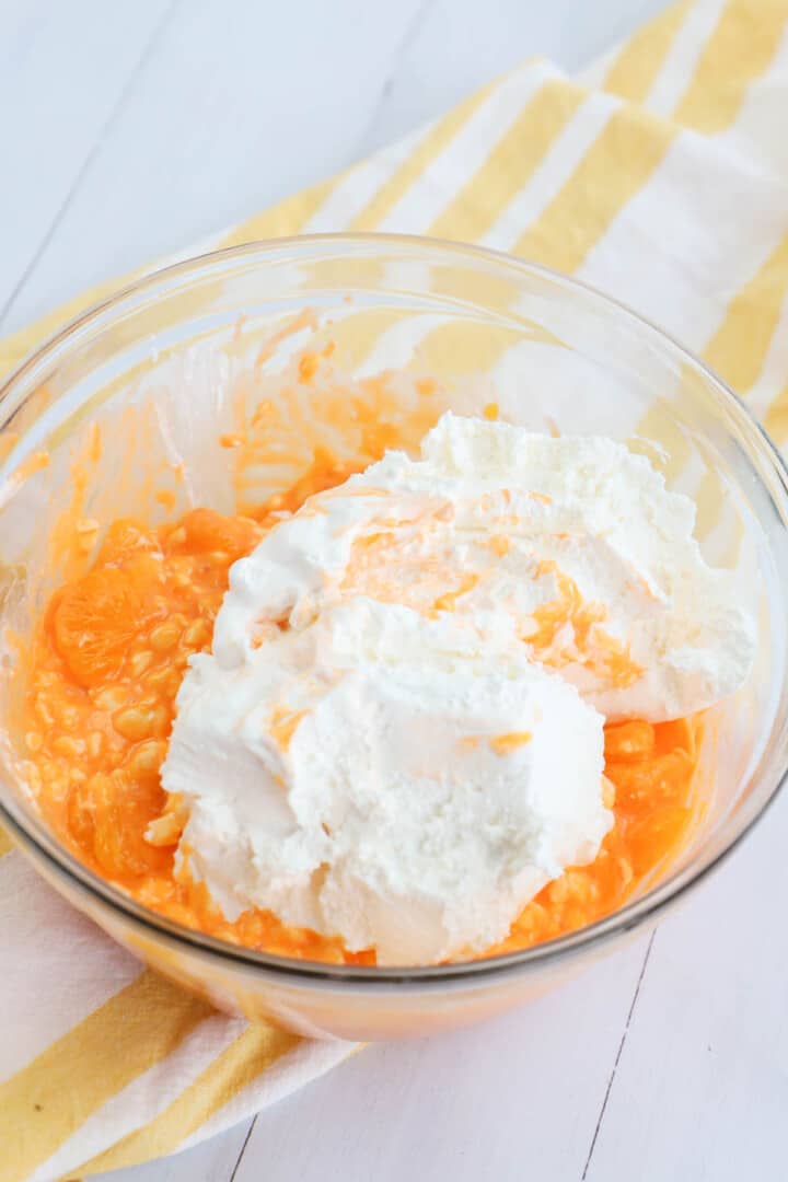 mixing in the mandarin oranges and the cool whip