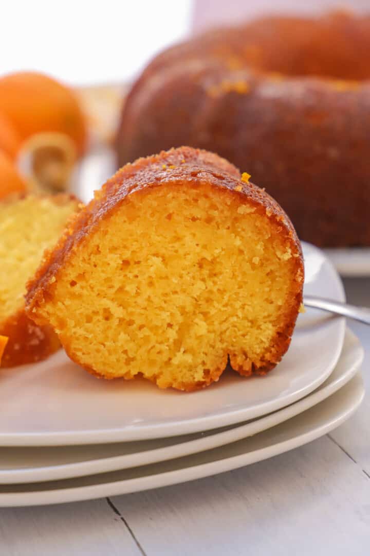 Orange Juice Cake on white stacked plates