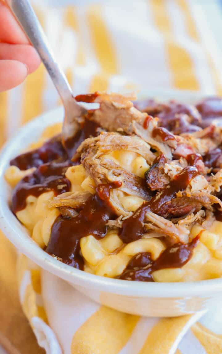 pulled pork mac and cheese closeup in white bowl