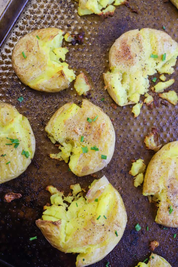 top view of smashed potatoes on baking sheet