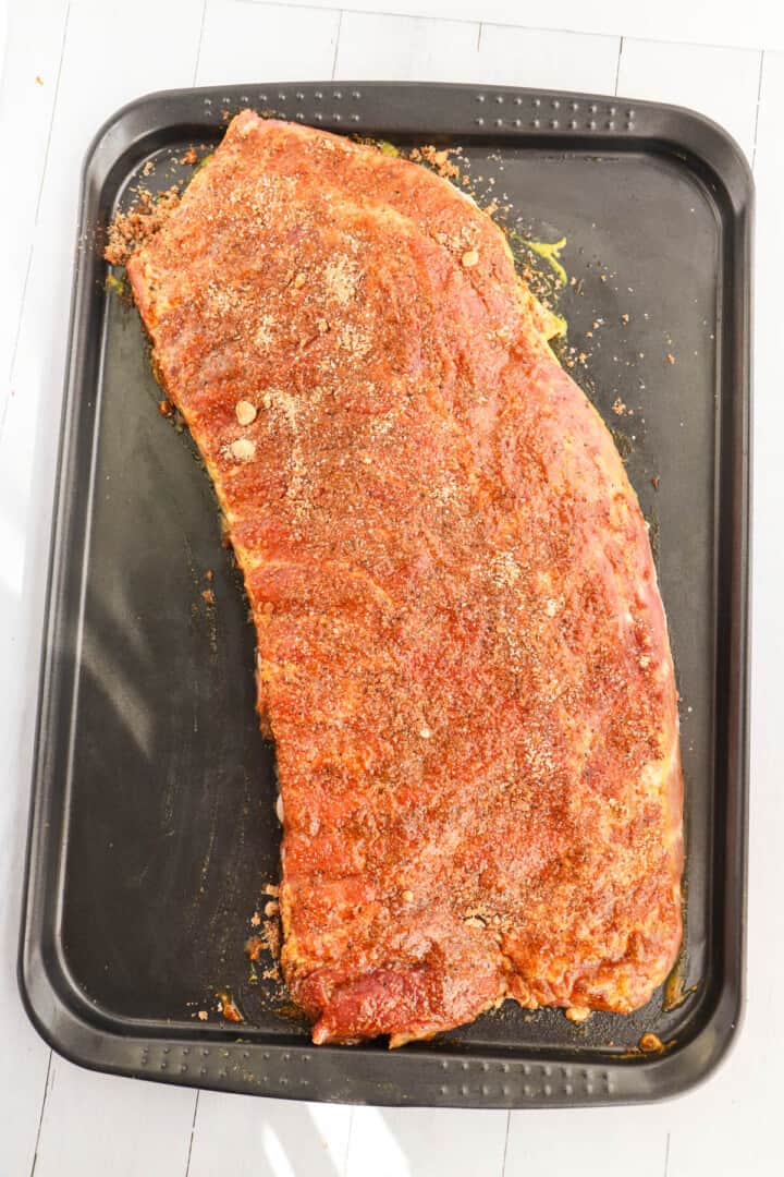 seasoning rubbed into ribs 