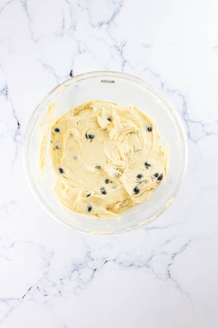 folding in the blueberries to the batter.