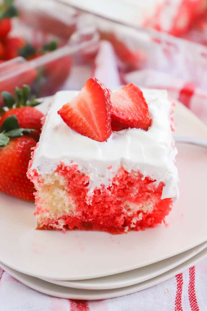 Strawberry Poke Cake slice on white plate