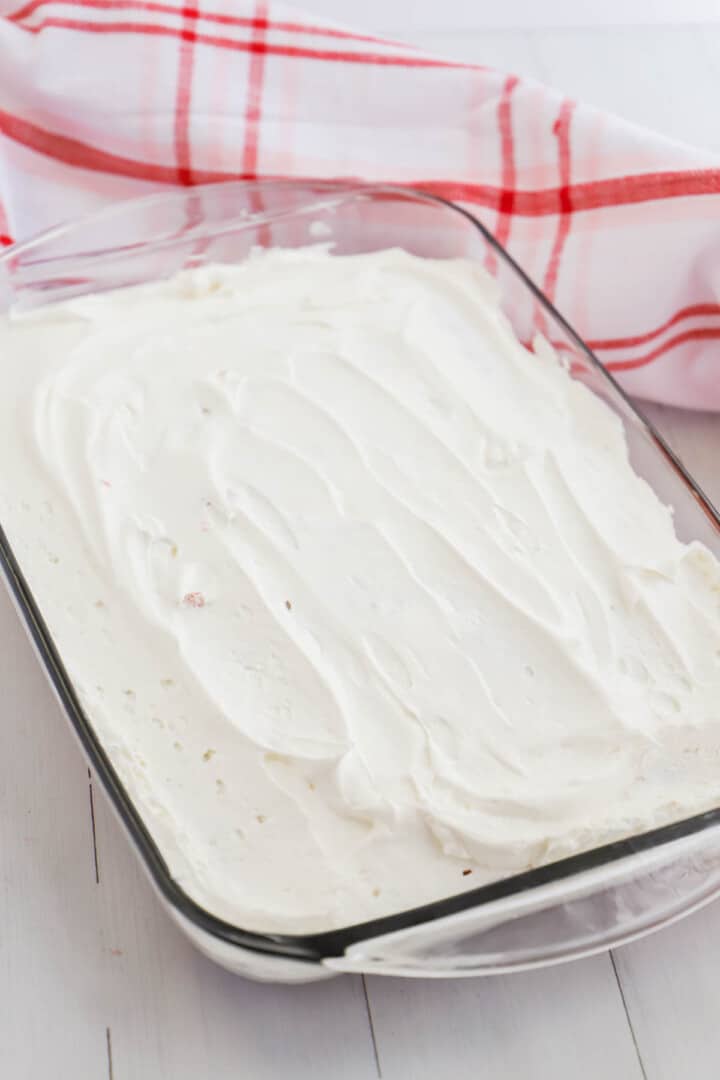 topping poke cake with cool whip