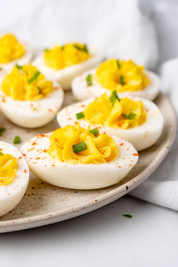 closeup of deviled eggs on serving plate.